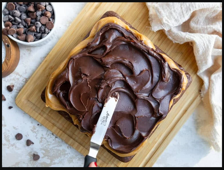 Thin layer of chocolate ganache spread evenly