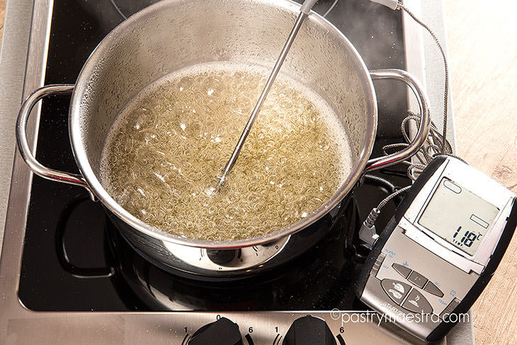 Sugar syrup reaching soft ball stage (118°C)